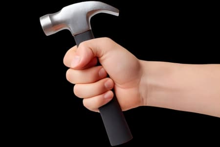 hand holding a hammer