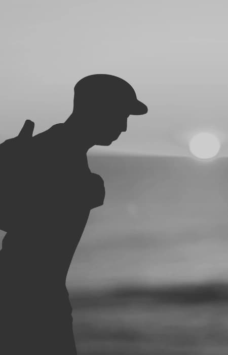 person walking at sunset